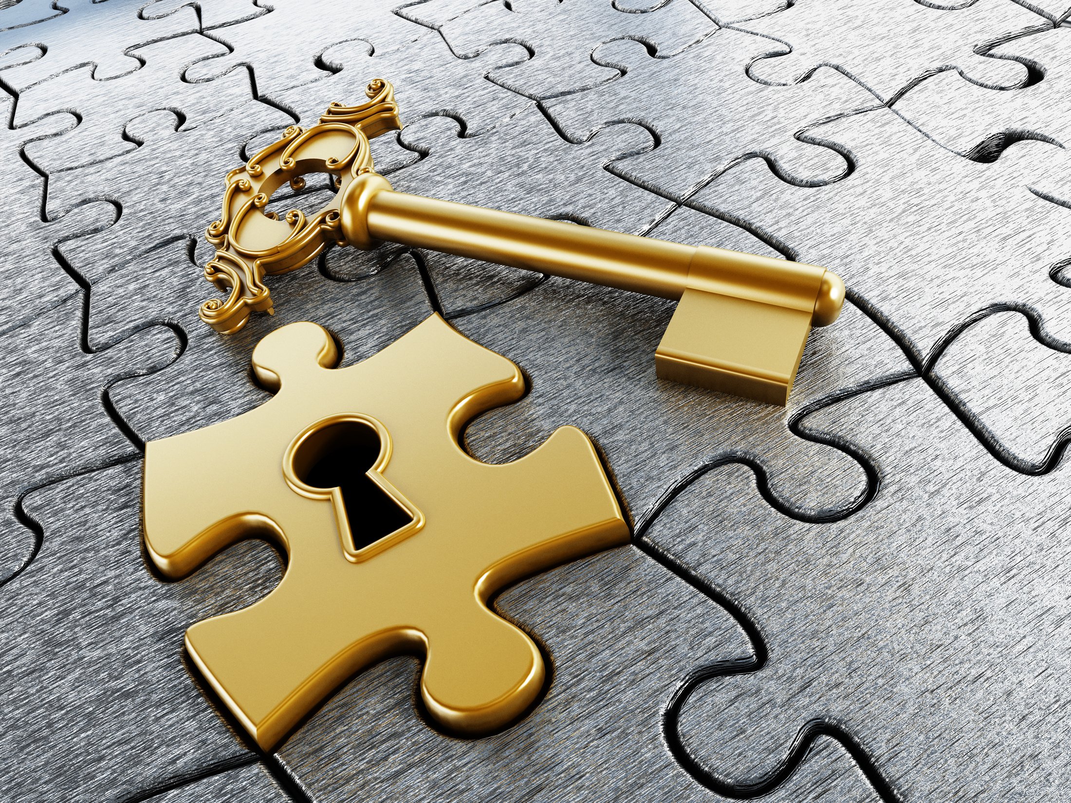 Gold jigsaw puzzle piece and key